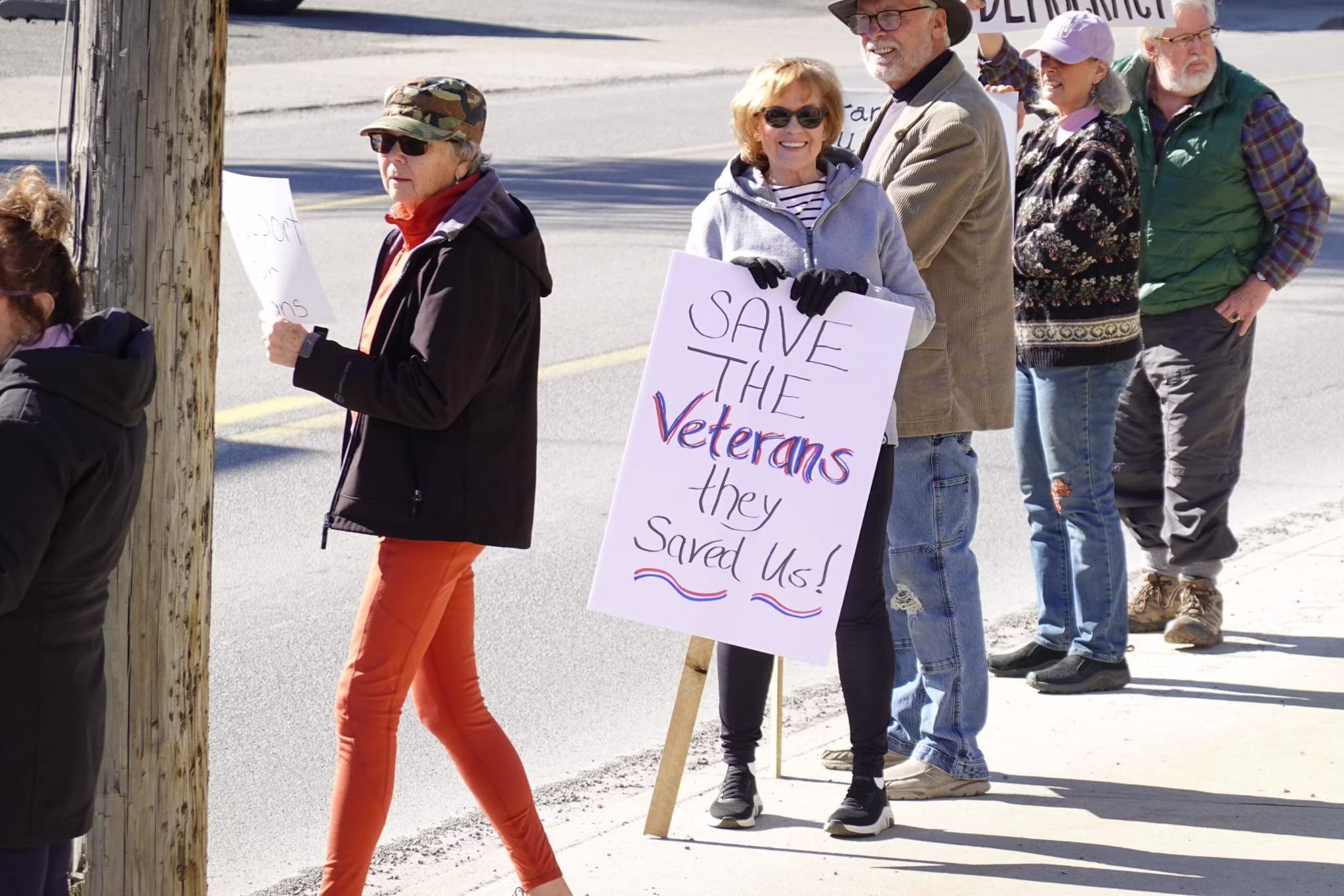Community members standing together at a rally