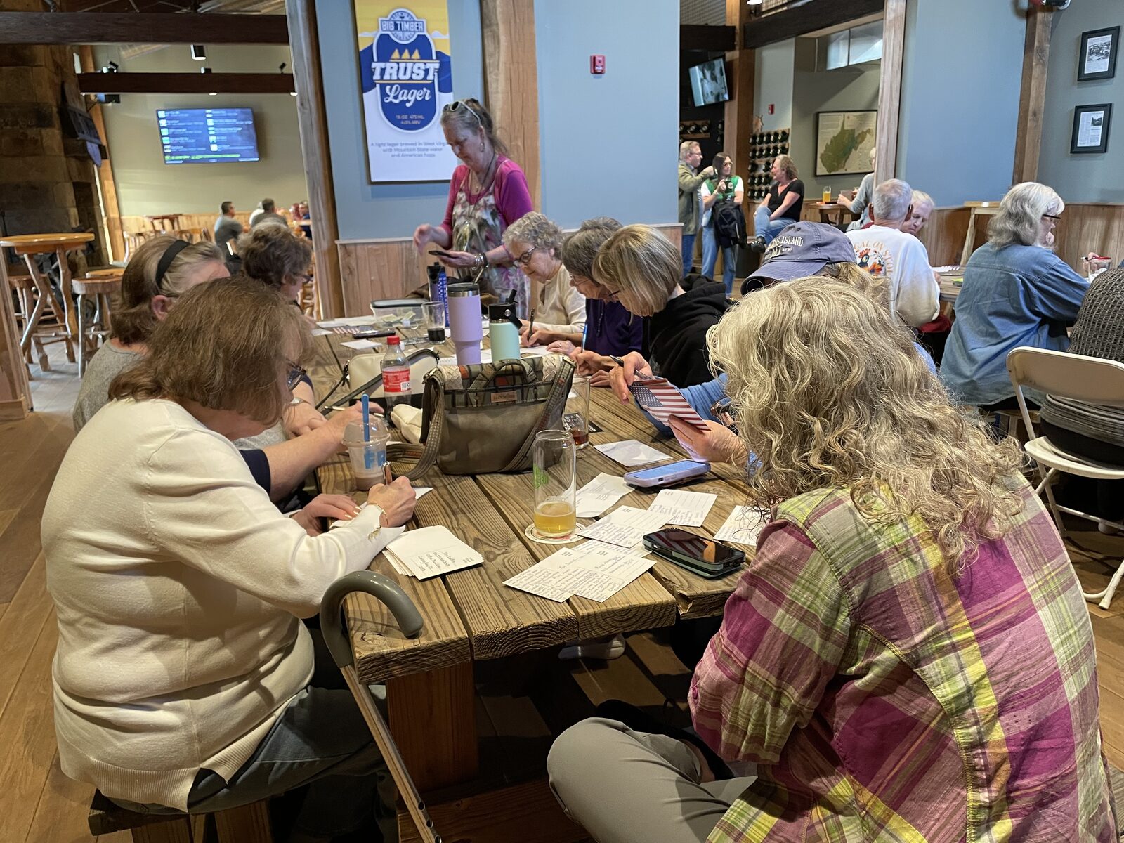 Volunteers writing postcards to voters at Big Timber