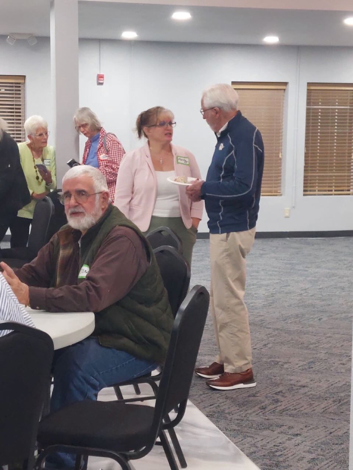 Members talking and mingling at a gathering