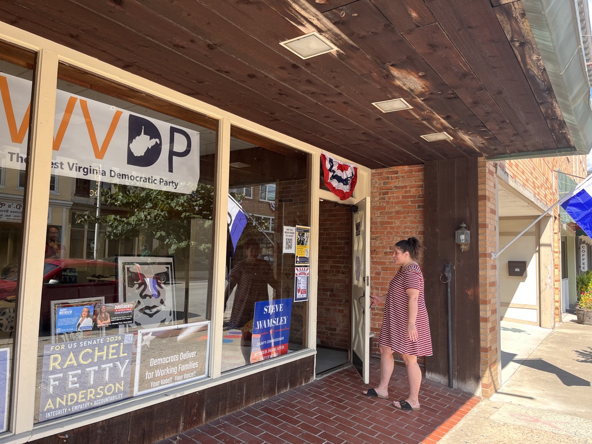 The Randolph County Democratic Party headquarters storefront on Third Street in Elkins, with a West Virginia Democratic Party banner and campaign signs in the window