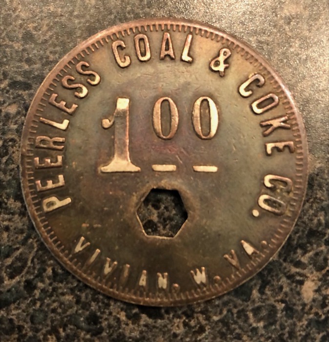 A one-dollar metal scrip coin from the Peerless Coal and Coke Company of Vivian, West Virginia
