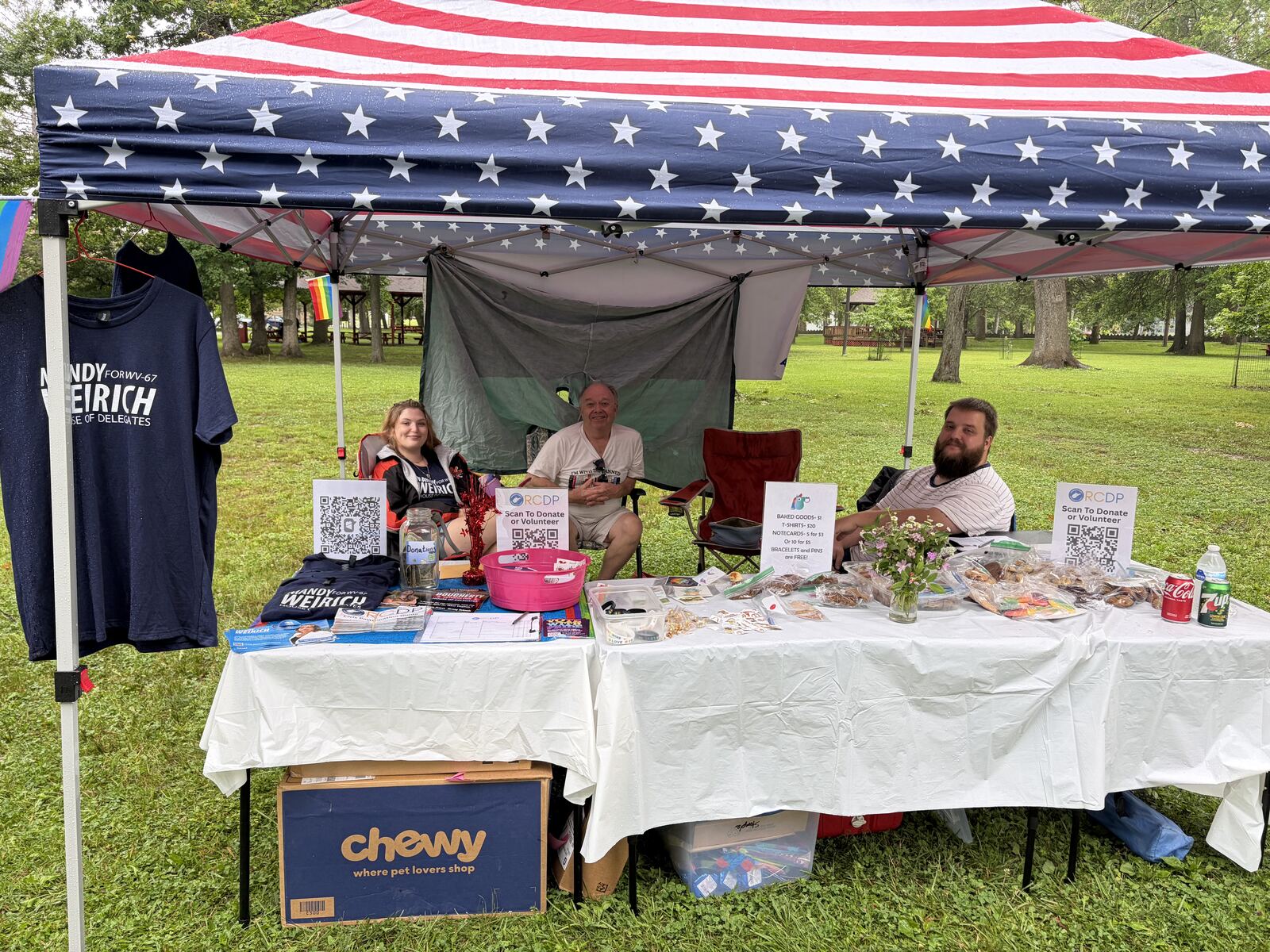 The Randolph County Democrats booth at Pride in the Park, with Pride T-shirts and a table of goods