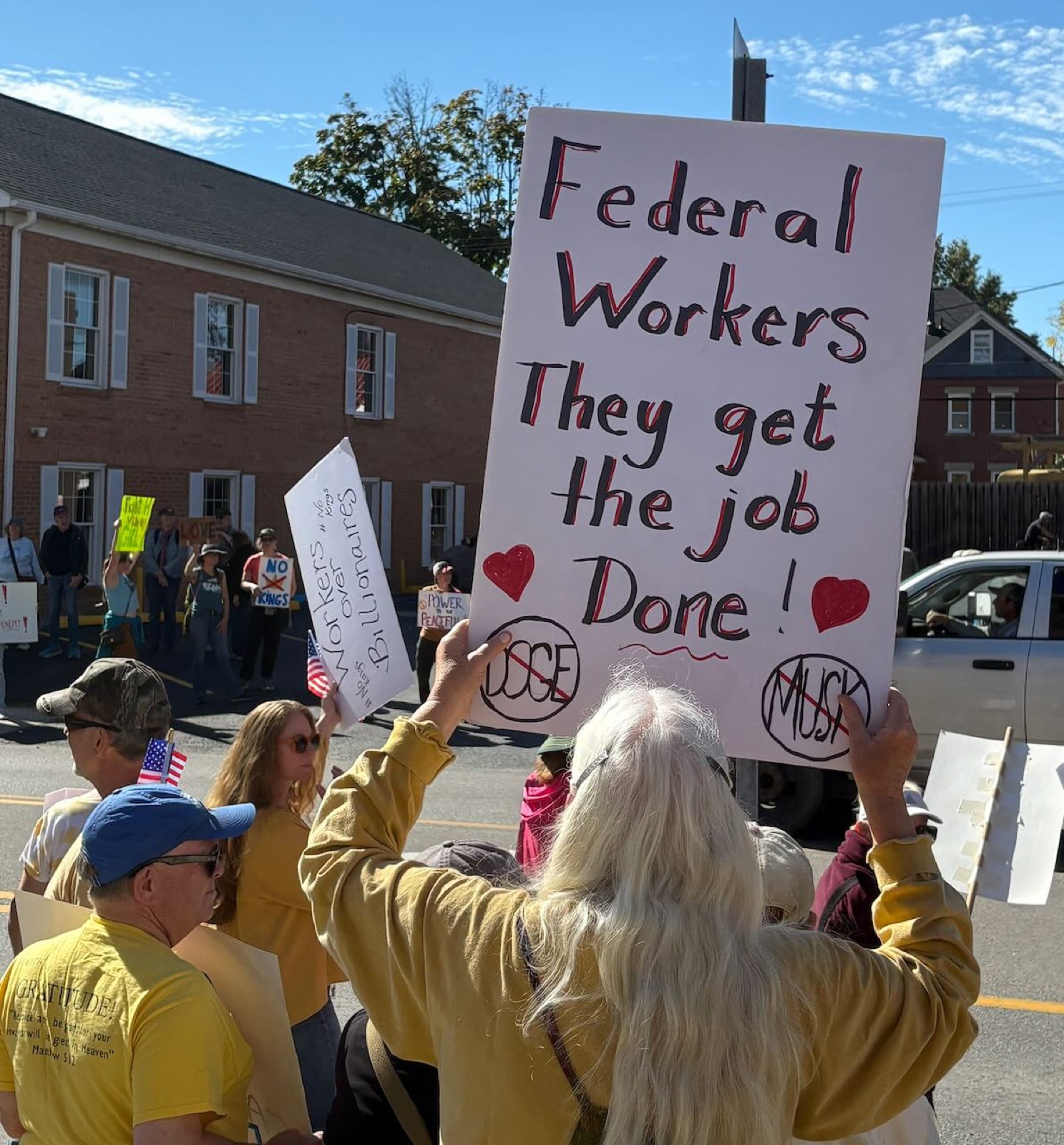 A sign reading Federal Workers, They Get the Job Done