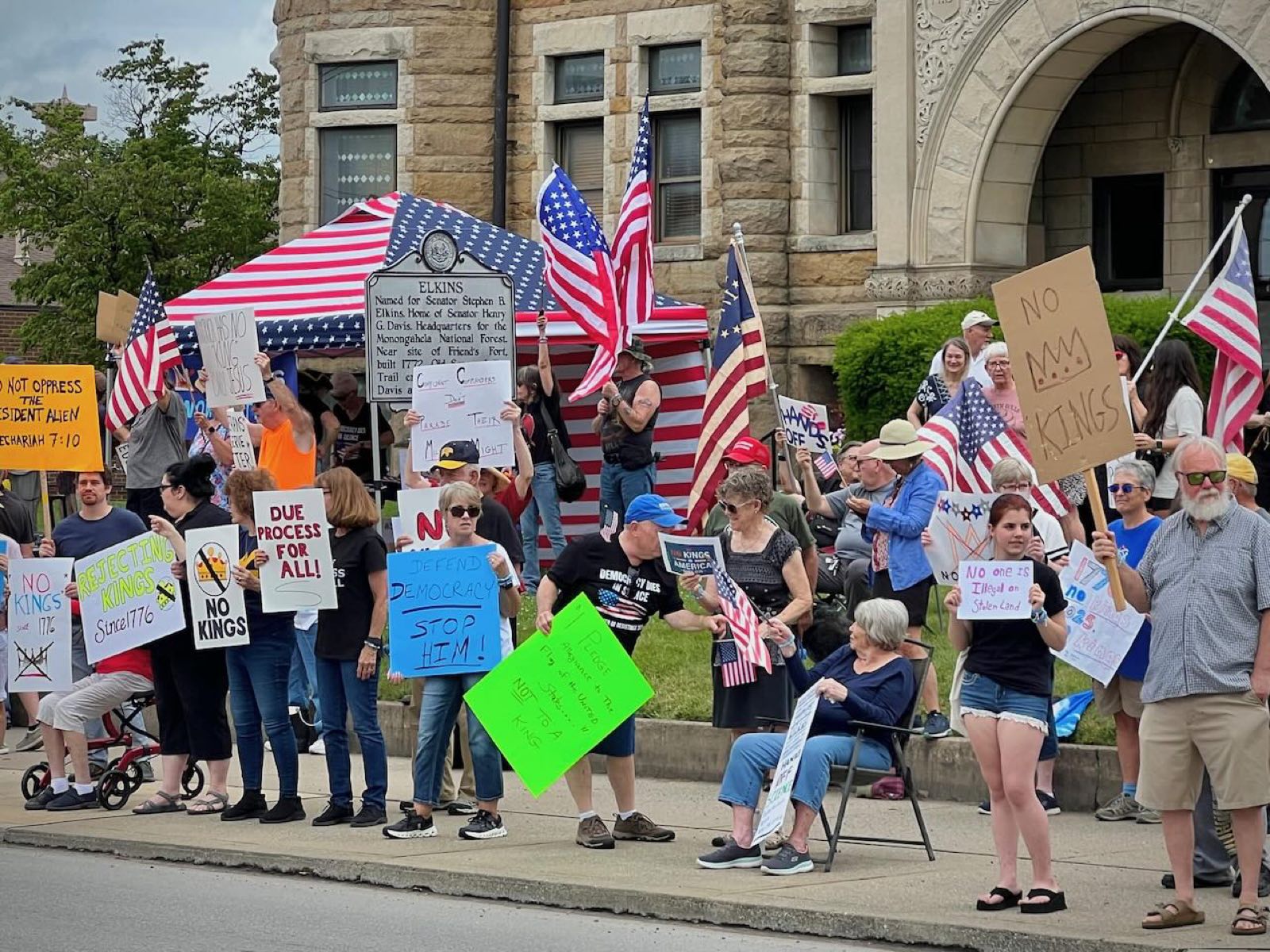 Demonstrators with American flags outside the courthouse in Elkins