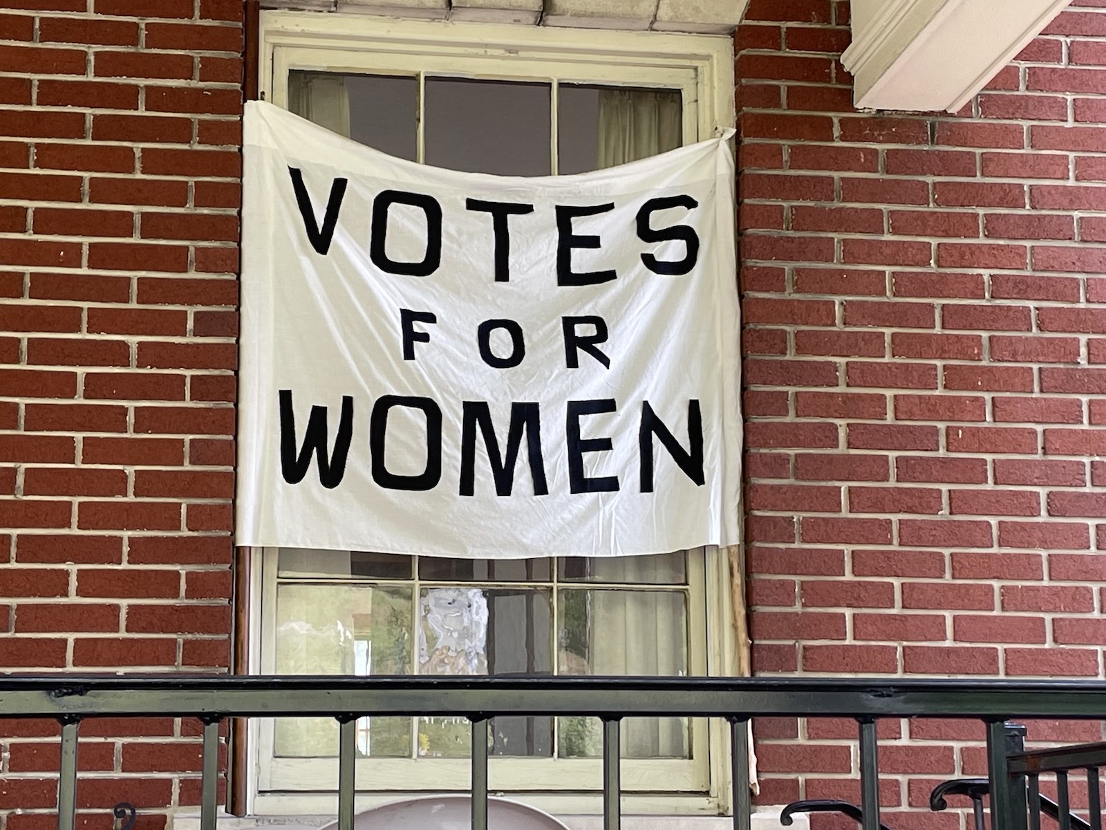 A 'Votes for Women' banner displayed at the Suffragist Tea